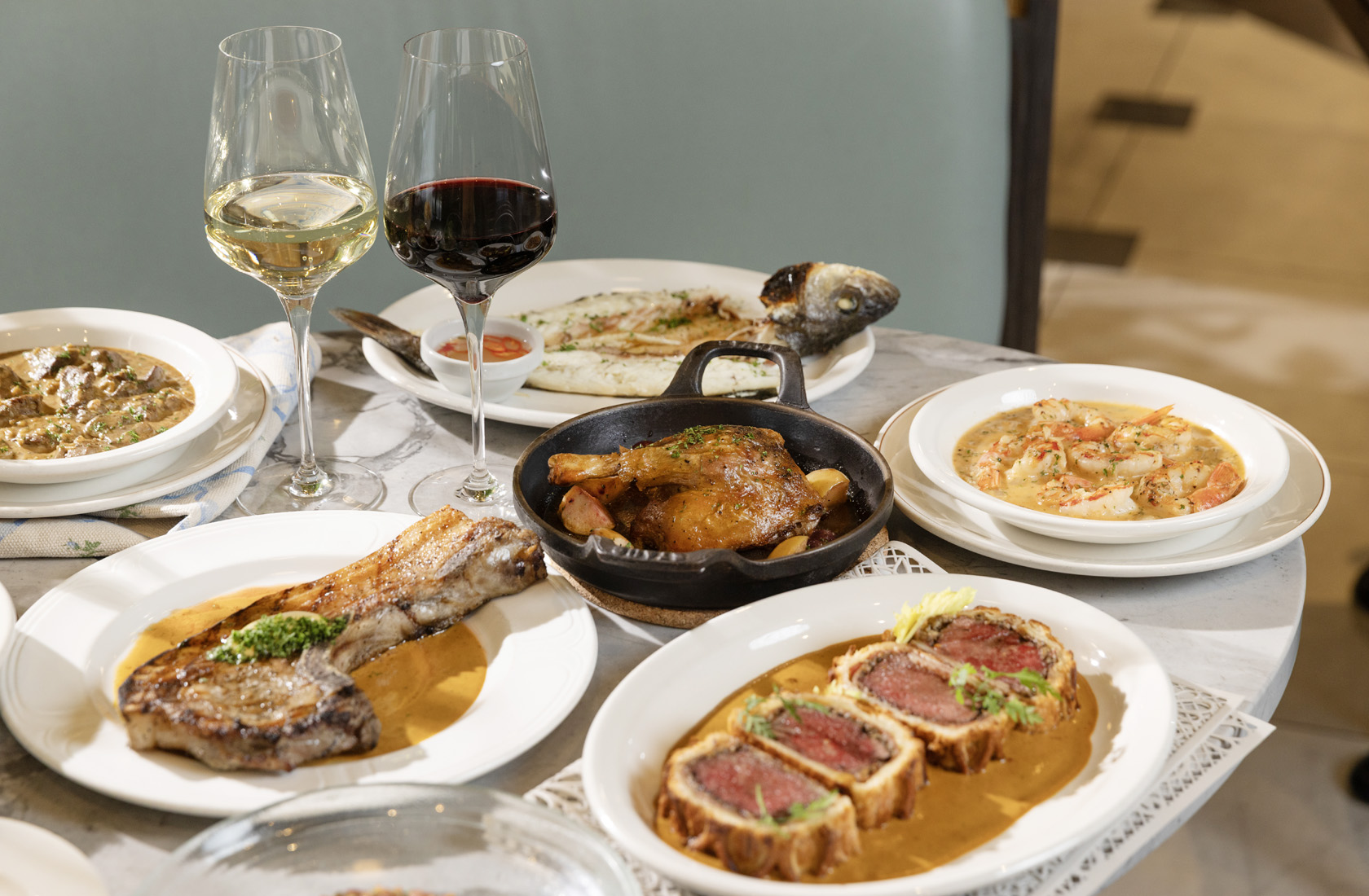 beef wellington,pork rack,seabass,duck rotisserie